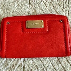 None west burnt orange zip around wallet